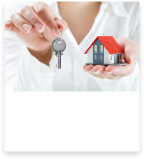woman holders keys and a tiny house
